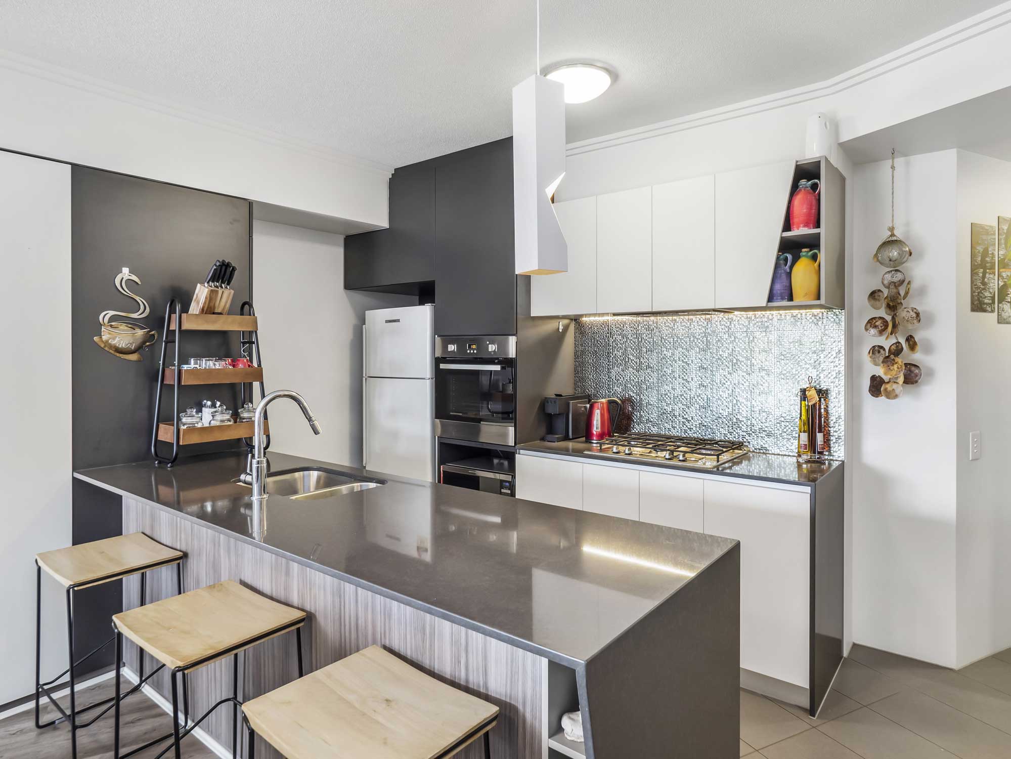 Real estate photography of Kangaroo Point apartment for sale - the kitchen