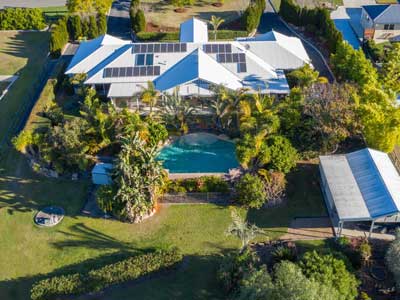 Acreage & drone photography of a real estate listing at Glen Logan Lakes Jimboomba
