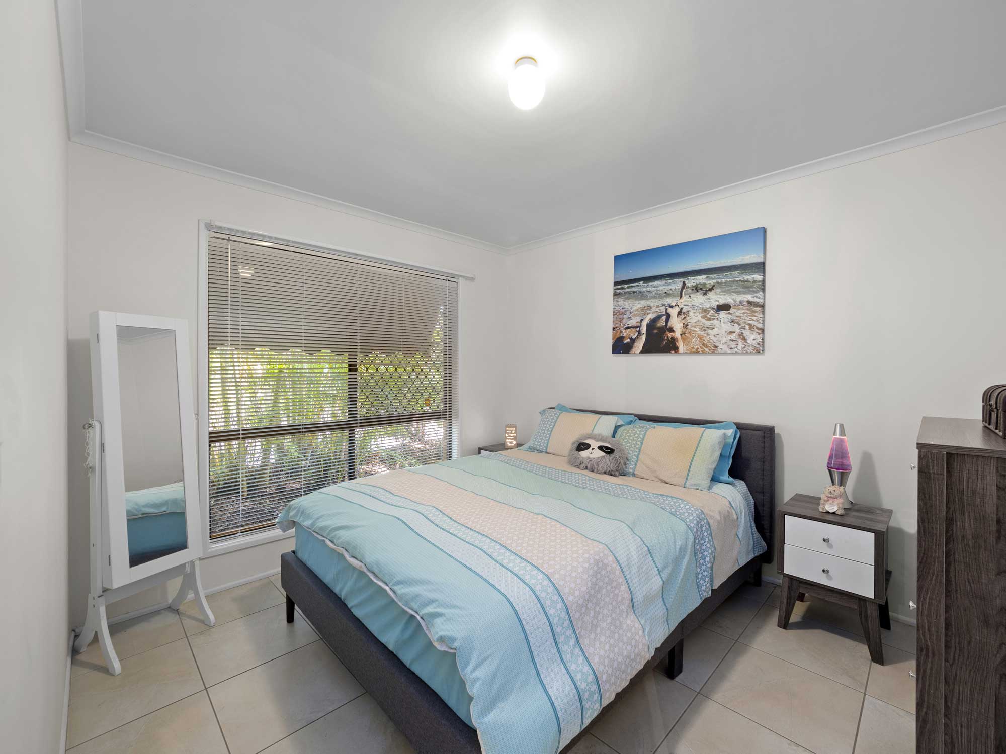 Capturing the master bedroom of the home for sale at Mitchelton